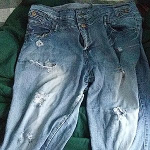 A pair pair  of  ripped  jeans